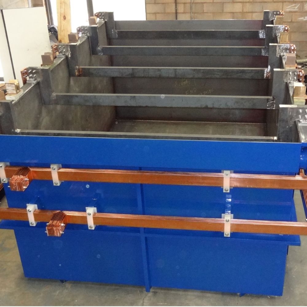 Blue steel process tank with copper bus bars built by a chemical equipment fabricator